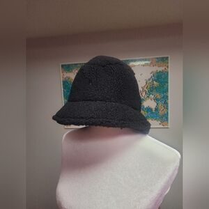 Black loops of yarn bucket hat.